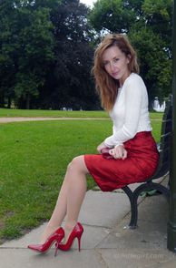Pretty Lady In Her Red Skirt And Heels
